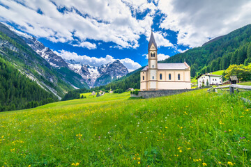 Fototapeta premium Church and Stilfs village in Idyllic Passo dello Stelvio, South Tyrol alps