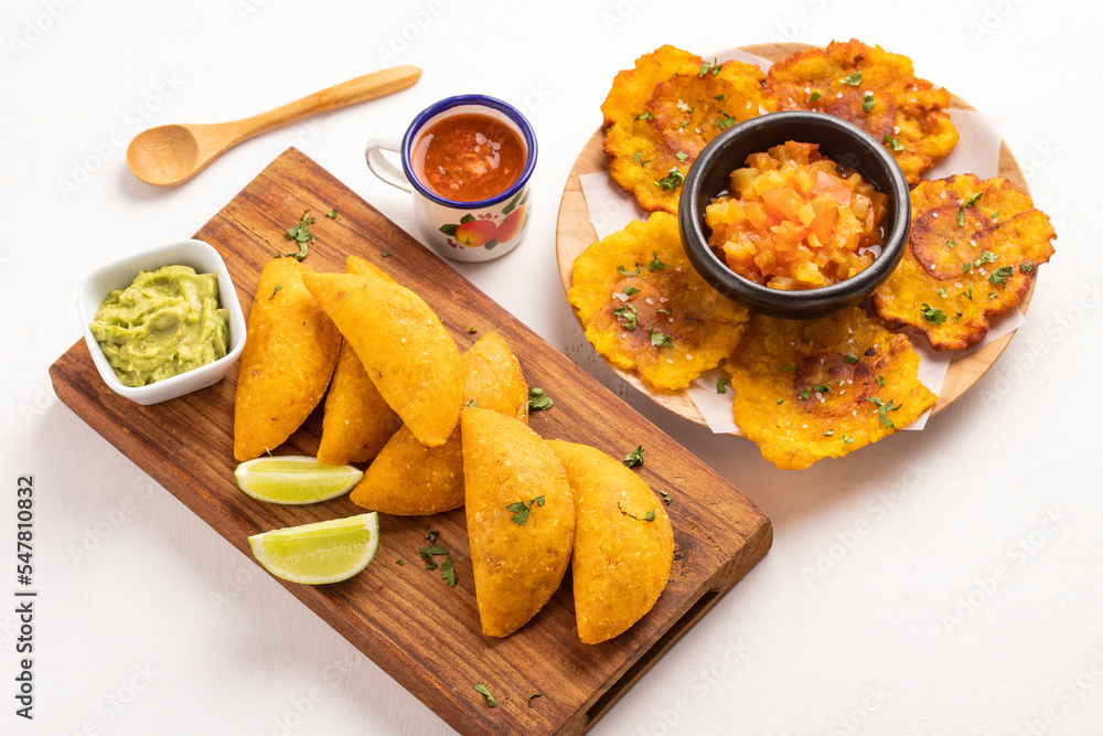 Wall mural homemade fried patacon and empanada - traditional colombian food