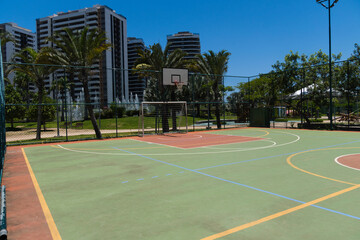 View of a sports court with beams and table with basket inside a park. Widely used for football, basketball and volleyball