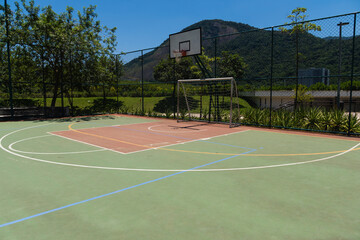 View of a sports court with beams and table with basket inside a park. Widely used for football, basketball and volleyball