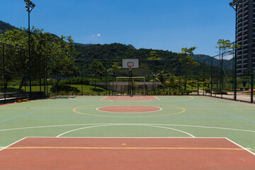 View of a sports court with beams and table with basket inside a park. Widely used for football,...