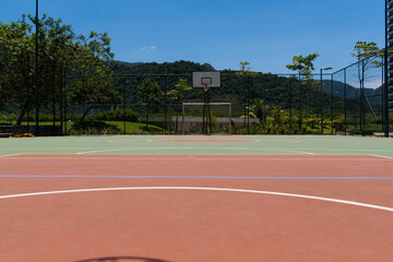 View of a sports court with beams and table with basket inside a park. Widely used for football, basketball and volleyball