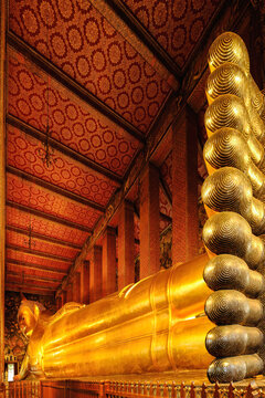 famous golden reclining buddha statue at wat pho in Bangkok Thailand