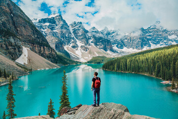 Canada travel man hiker at Moraine Lake Banff National Park, Alberta. Canadian rockies landscape people hiking with backpack lifestyle - 547814228