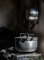 A rural kitchen with the aluminum pot on the stove