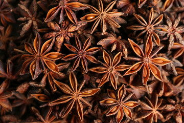Aromatic anise stars as background, top view - obrazy, fototapety, plakaty