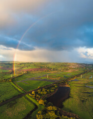 Rainbow over Wetlands from a drone, RSPB Exminster and Powderham Marshe, Exeter, Devon, England