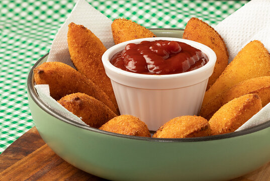 Typical Brazilian snack risoles in a plate.