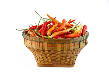 Red chili pepper in wooden basket isolated on white background.