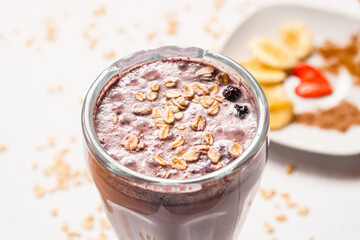 Oat and berries smoothie on a white background. Drink.