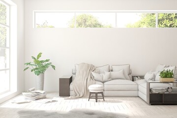 Fototapeta premium White living room with sofa and summer landscape in window. Scandinavian interior design. 3D illustration