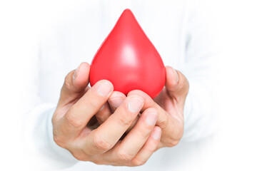 Hand of a healthy man hold symbol blood.Help and Health Concepts