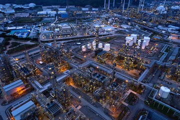 Fototapeta na wymiar aerial view oil refinery Oil and gas industry, petrochemical plant area and energy concept, oil storage tanks at night time with lights.