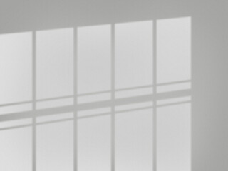 窓の影が壁に映るグレーの背景