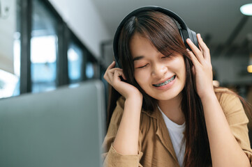 Young woman enjoy to listening music on headphone
