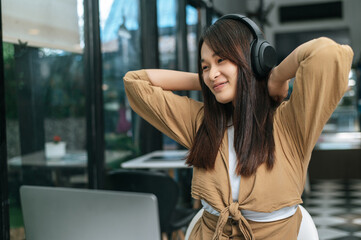 Young woman enjoy to listening music on headphone