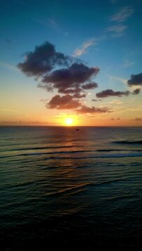 Sunset over the ocean horizon in Honolulu Hawai'i.