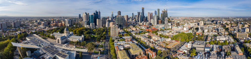 Aerial panoramic views of the beautiful Melbourne Exhibition building in Carlton, with the cbd in the background