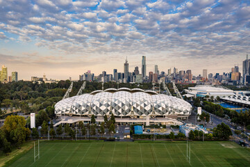 Naklejka premium Melbourne Australia May 15th 2020 : Aerial panoramic dawn view of AAMI stadium, with the Melbourne city in the background