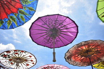 Traditional colorful paper umbrella called "Payung Geulis" from Indonesia