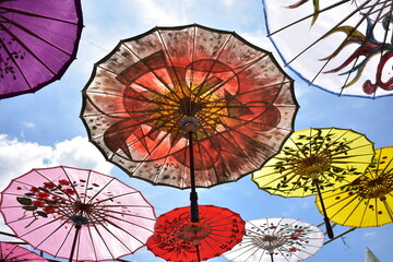 Traditional colorful paper umbrella called "Payung Geulis" from Indonesia