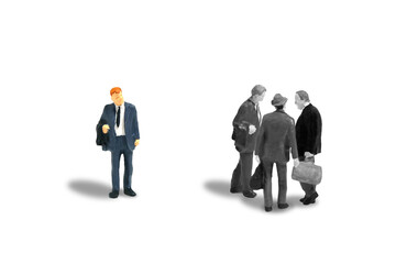 Miniature people toy figure photography. Office gossip concept. A businessman worker talking about someone. Isolated on white background.
