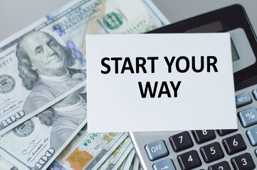 Start your way text card on the background of a calculator and money on the table, a business concept