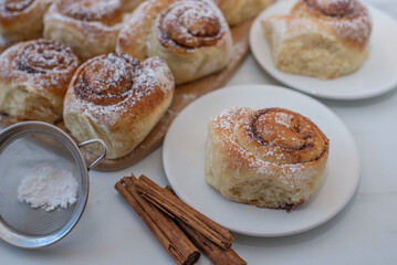 Cinnamon buns. Beautiful fresh cinnamon rolls on a table