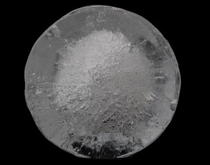 Naklejka premium transparent ice in the shape of a circle on a black background