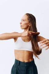 A woman with long brown hair stands back and takes care of her hair after washing and combing her hair with a wooden comb. Healthy hair without hair loss