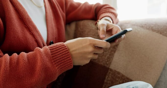 Hands, phone and woman on sofa typing on social media, text message or browsing internet. Relax, living room and female scrolling on 5g mobile or smartphone, networking or web search alone in house.