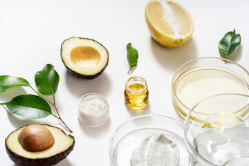 Alternative natural medicine and glass labware, petri dish, cream jars, scrub, aroma oils. Avocado...