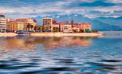 Ajaccio town reflected in the calm waters of Mediterranean sea. Colorful morning scene of Corsica...