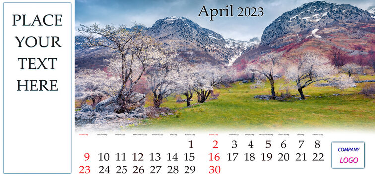 April 2023. Desktop monthly calendar template with place logo and contact information. Set of calendars with amazing landscapes. Blooming apple trees in Theth National Park, Albania, Europe.