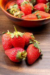 Fresh and Juicy beautiful organic strawberries on wooden background. Top view point.