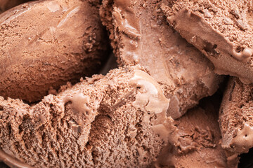 Dark brown chocolate ice cream, close-up, top view.