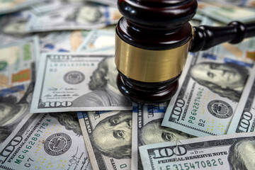 law lord using a gavel to deliver a verdict of court judgment in dollar courts.