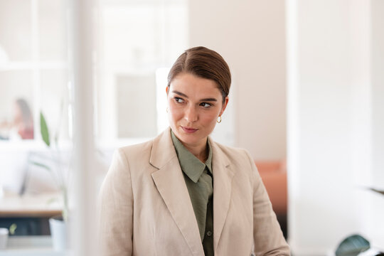 Businesswoman wearing blazer in office