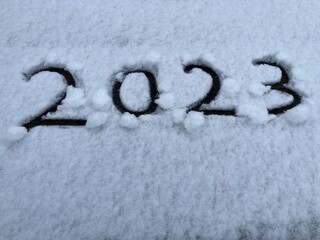 the number 2023 is carved in the snow
