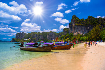 Fototapeta na wymiar Long tail boats and rocks on Railay beach west, Ao Nang, Krabi,