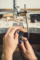 Close up qualified jeweller concept photo. Jewelry saw. Tool for metal. Front view photography with instruments on background. High quality picture for wallpaper, travel blog, magazine, article