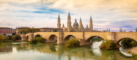 Saragossa,  panorama city landscape at sunset ( bridge and pillar basilica,  Aragon in Spain)