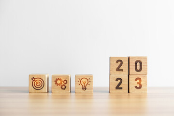 2023 wood block with business goal, plan. Action strategy, target, mission, teamwork, idea and New Year start concept