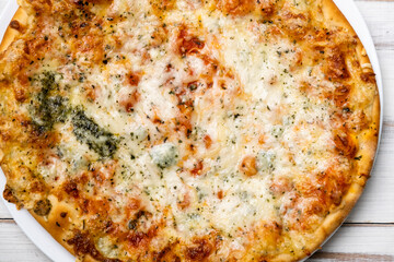 Freshly cooked pizza with blue cheese. Close-up.