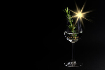 Tasty gin, Christmas card with a beautiful glass of gin ,rosemary and a golden christmas star.