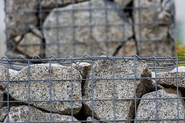 Stones and metal net as fence