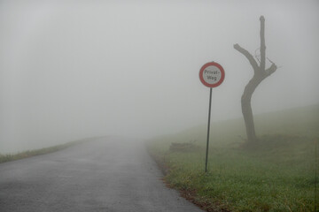Privatweg im Nebel . Private road in the fog