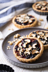 tartlets with apple jam and blueberry confiture