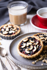 tartlets with apple jam and blueberry confiture