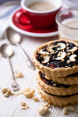 tartlets with apple jam and blueberry confiture